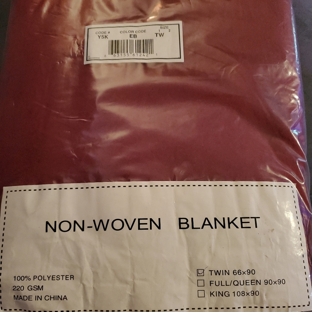 Non-woven twin blanket new in pkg